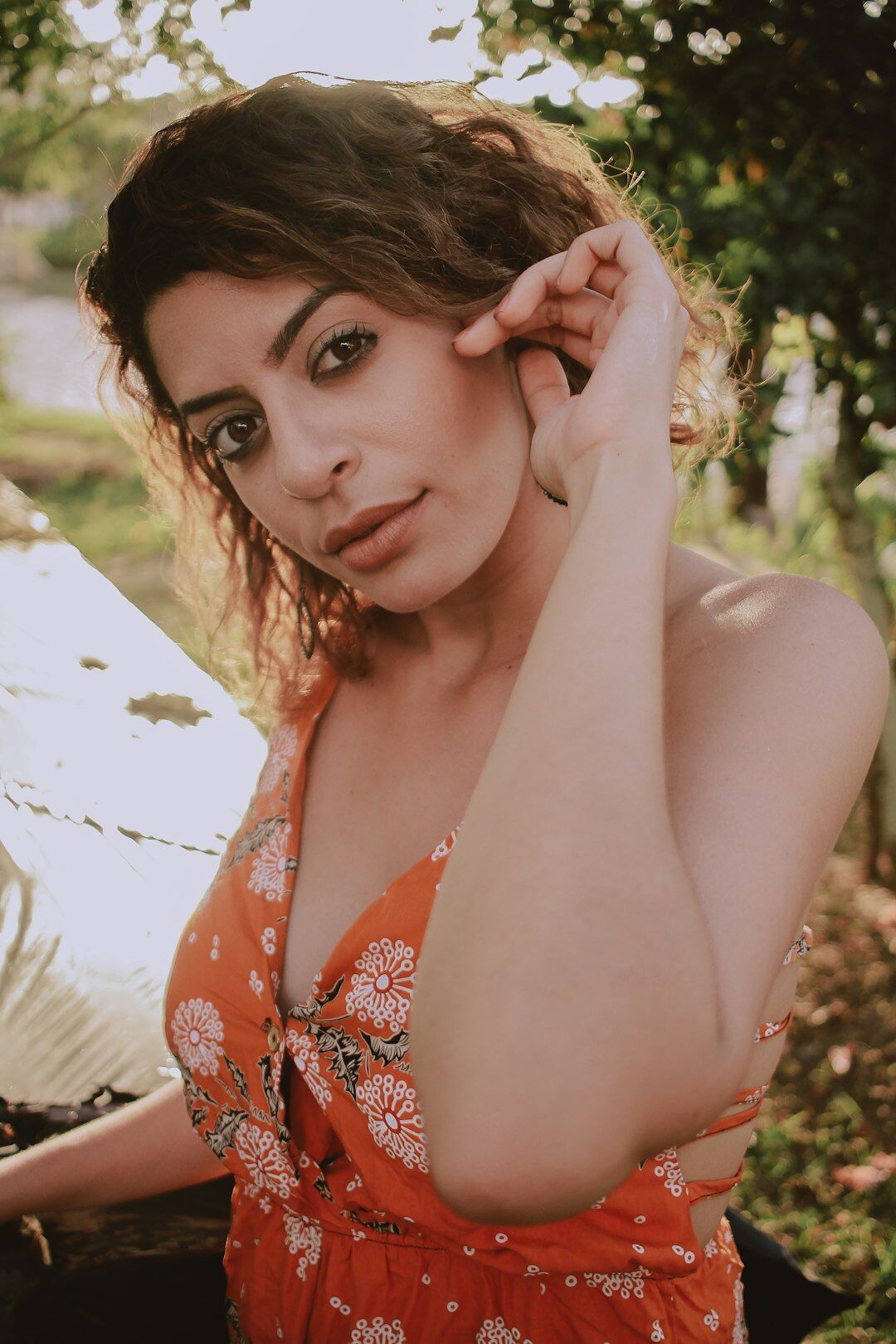 Portrait of a Brazilian woman with curly hair smiling